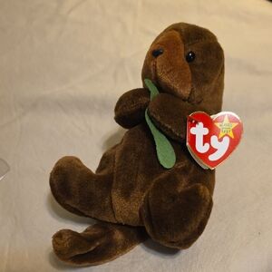 Ty Brown Otter Plush with Green Leaf